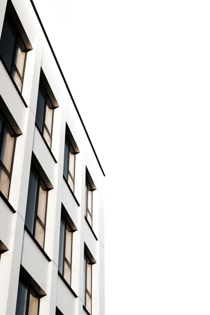 Minimal white architecture with repeating windows, representing structure, patterns and clarity.